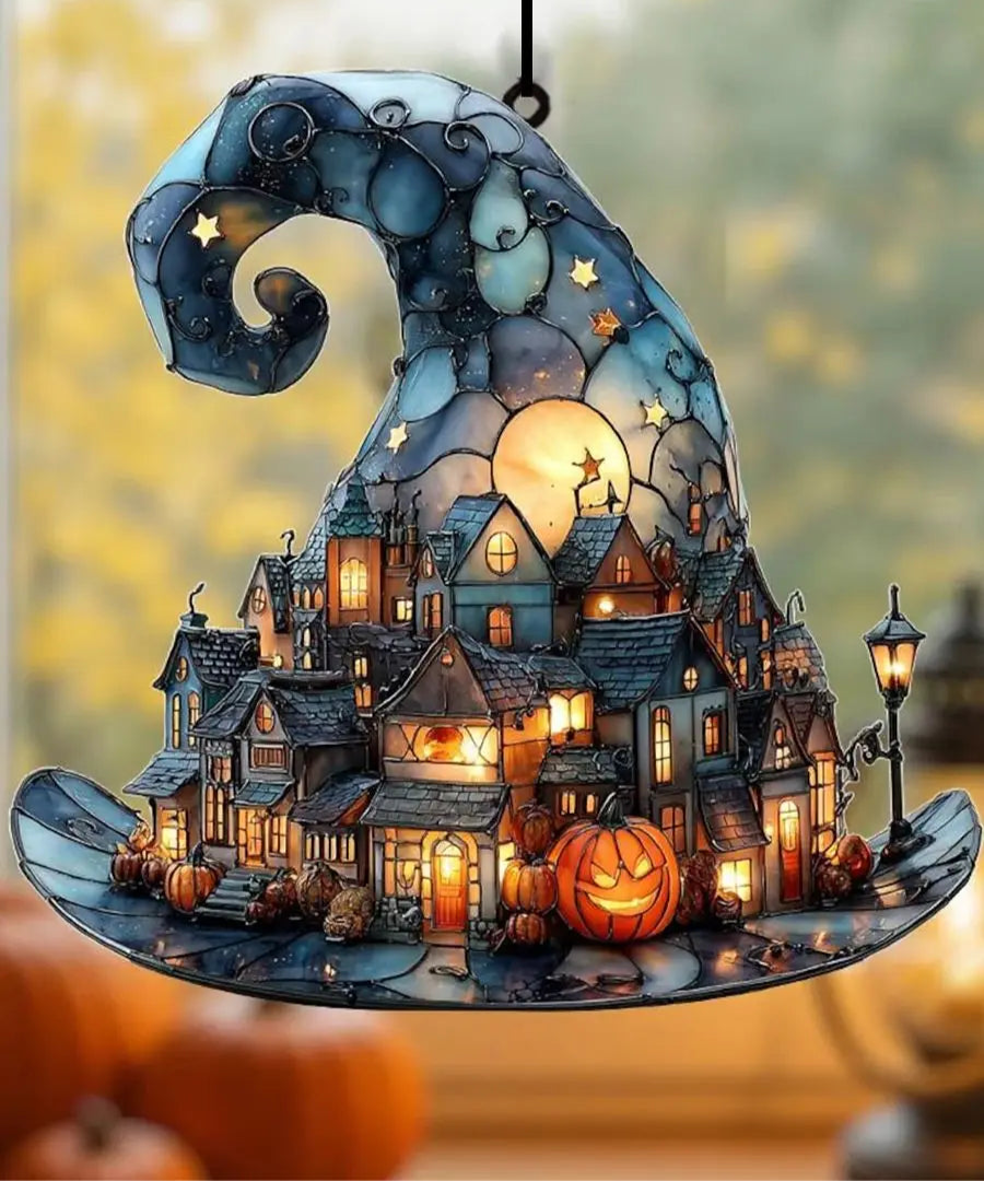 Halloween-themed ornament with a village scene, pumpkins, and a full moon.