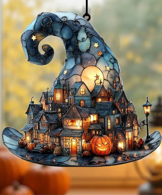 Halloween-themed ornament with a village scene, pumpkins, and a full moon.